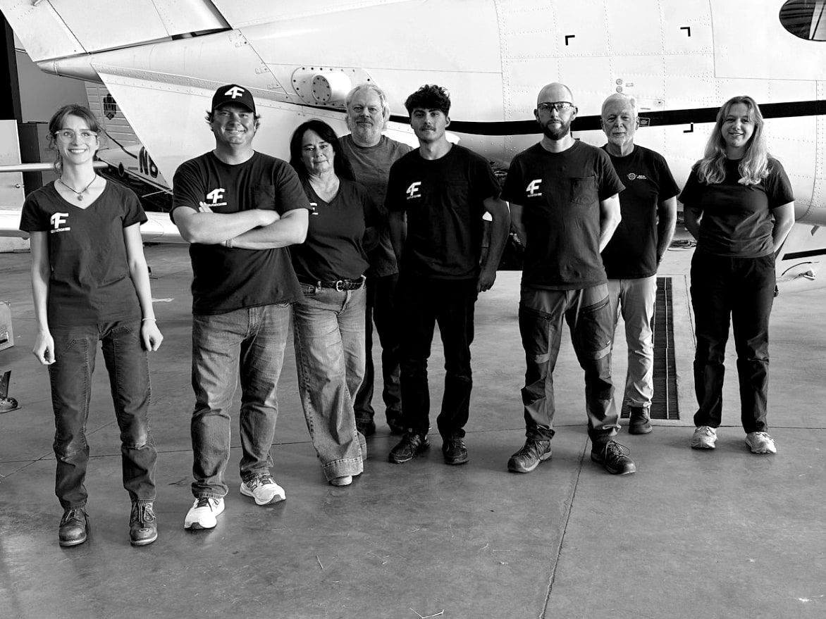 The Colorado Springs crew together in front of a customer aircraft in the Fourth Front hangar