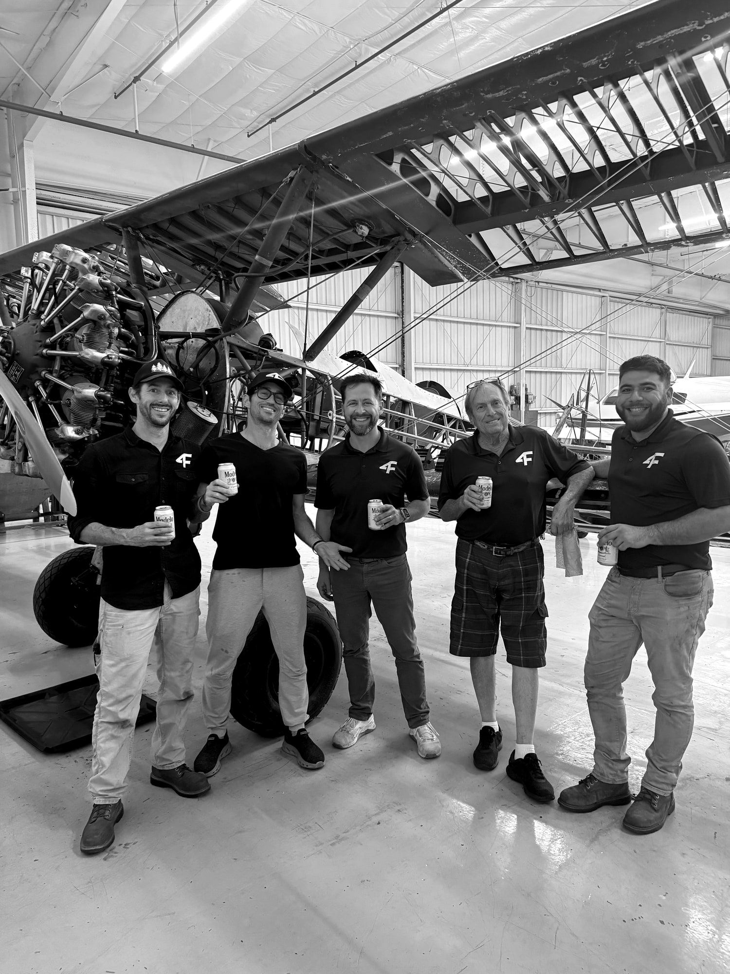 The Santa Monica crew together in front of the Stearman in Hangar 1