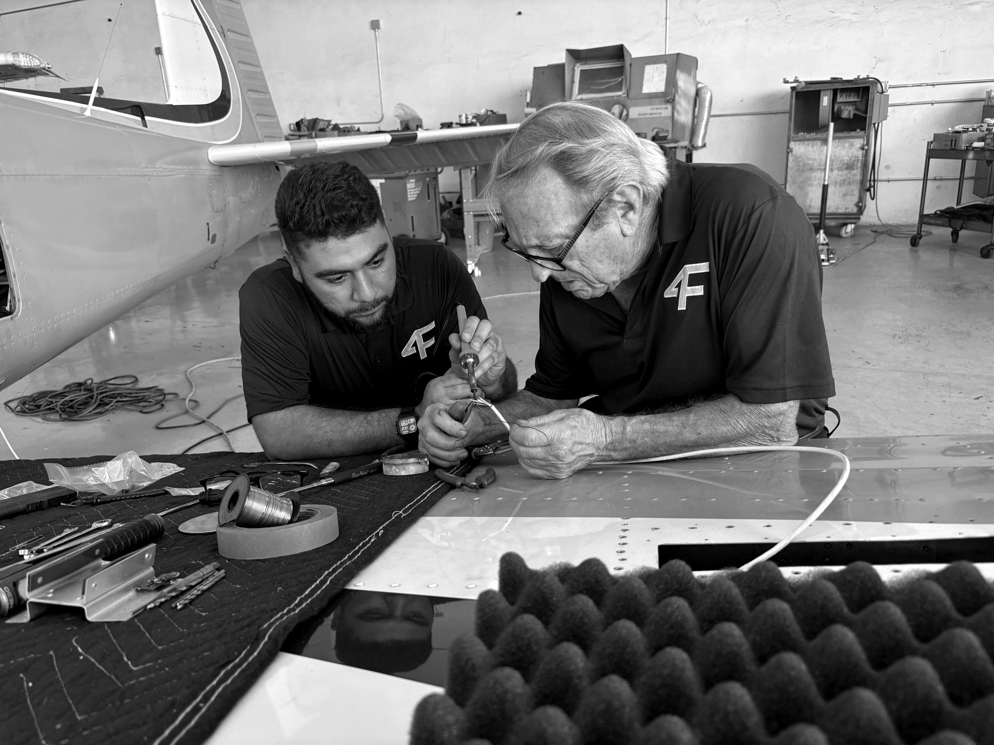 Technicians doing sheet metal repair on a wing panel in Fourth Front's Hangar 1 at Santa Monica Airport