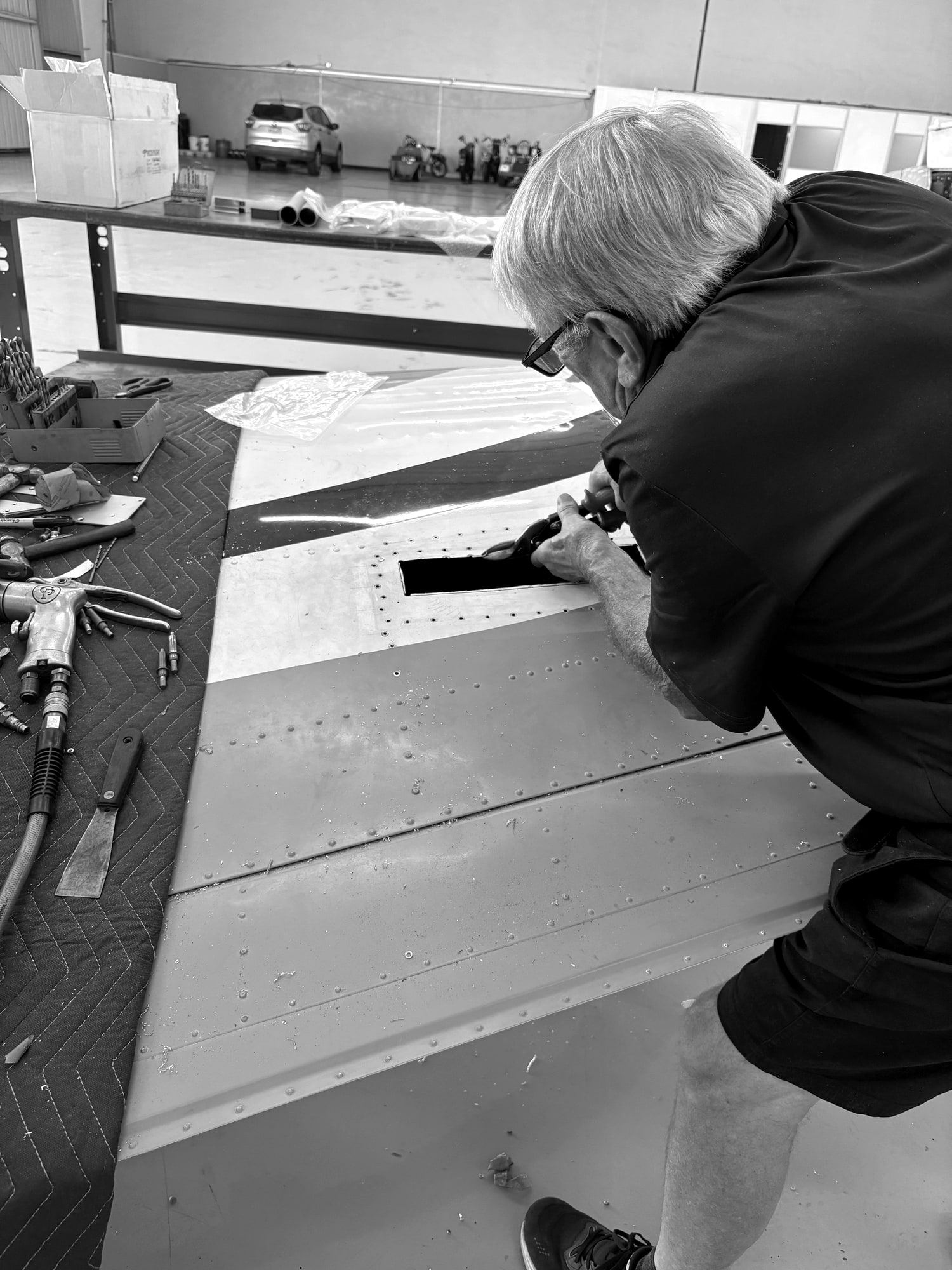 Technician riveting a control surface repair at Fourth Front Santa Monica